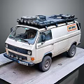 White Winnebago Van With Roof Rack And Spotlights For Camping Travel