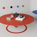 Red Round Coffee Table With Camera Small Box And Colorful Spheres 3d model