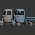 Two Different Colored Cargo Tricycles With Open Bed And Front Cabin Design