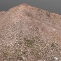 Natural Rocky Hill Terrain With Earthy Surface And Rough Texture Against Dark Background