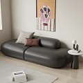 Black Leather Two Seater Sofa with Pillows Small Side Table Lamp Book and Decorative Painting
