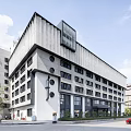 Modern Industrial Factory Building Exterior With Geometric Roof And Large Windows