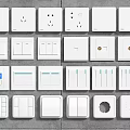 Diverse White Switch Panels With Different Button Sizes Sockets And Digital Display Features