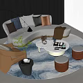Curved Light Colored Sofa with Cushions and Round Coffee Table Set on Blue Patterned Rug 3d model
