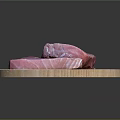 Fresh Tuna Meat Pieces Displayed On Round Wooden Cutting Board