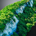 Scenic Cliff Terrain Adorned With Lush Green Vegetation And Natural Rock Formations