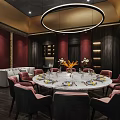 Elegant Modern Chinese Private Dining Room With Round Table Dark Chairs Wooden Walls And White Sofa