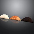 Three Different Colored Croissants White Butter And Chocolate On Dark Background
