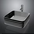 Modern Bathroom Sink In White With Black Stripes And Chrome Faucet On Dark Surface