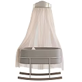 Gray Rocking Baby Crib With Metal Frame Wooden Rockers Star Patterned Pillows And Striped Blanket
