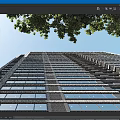 High Rise Residential Building With Multiple Windows Surrounded by Green Trees Under Clear Blue Sky