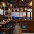 Cozy Japanese Restaurant Interior With Wooden Fixtures Kumamon Decor And Beautiful City Night View