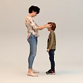 Group of People Interacting Indoors With Adults Dressing Children And Hugging