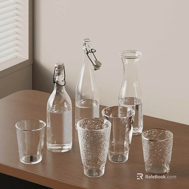 Clear Glass Bottles And Drinking Glasses Display On Wooden Table 3d model 