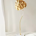 Elegant Gold Leaf Shaped Floor Lamp With Modern Curved Stem Design 3d model
