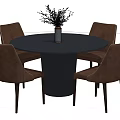 Round Black Dining Table Set With Brown Leather Chairs And Vase With Dried Flowers