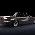 Silver Sedan Car with Classic Design and Alloy Wheels on Dark Background