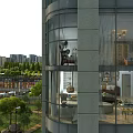 Modern Garden Landscape with Trees Lawns Street Lamps near Glass Wall High Rise Building