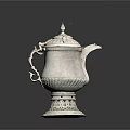 Elegant White Electric Kettle With Ornate Carved Design And Decorative Base