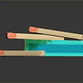 Colorful Wooden Matches With Orange Tips And Green Patterned Matchbox