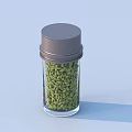Glass jar with gray lid filled with green food spices on light blue background