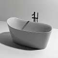 Modern Freestanding Bathtub With Sleek White Design And Black Faucet In Minimalist Style