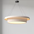 Modern Circular Pendant Light Hanging With Warm Glow And Sleek Design