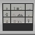 Black Display Cabinet With Multiple Compartments Holding Decorative Items Vases And Small Plants