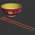 Red Bowl With Yellow Interior And Gold Flower Designs Plus Red Chopsticks With Gold Accents