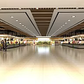 Modern Supermarket Department Store Interior With Spacious Aisles Shelves Ceiling Lights And Shoppers