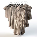 Colorful Children's Clothes Hanging With Striped Star Polka Dot And Floral Designs