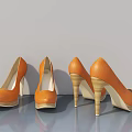 Three Pairs Of Orange High Heels With Wooden Heels On Gray Background