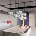 Playful Indoor Space With Hanging Clouds Giraffe Sculpture Pink Ball Pit And Blue Door Frame