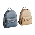 Two Blue and Beige Leather Backpacks With Zipper Pockets And Classic Design