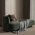 Green Velvet Chaise Lounge With Brown Cushion And Checkered Blanket In Room