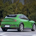 Green Modern Electric Car Sleek Exterior Design With Tree Background And Outdoor Road