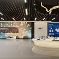 Innovative Exhibition Space With Large LED Screen And Golden Circular Lighting Design
