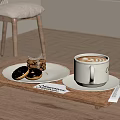 White Coffee Cup with Latte Art on Wooden Tray alongside Donuts Pastry and White Utensils