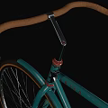Vintage Green Bicycle With Brown Leather Seat And Classic Spoked Wheels
