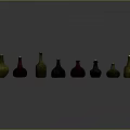 Colored Glass Bottles Neatly Arranged On Gray Background With Various Hues