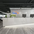 Modern Public Office Area Interior With Desks Computers Chairs Green Plants And Ceiling Lights