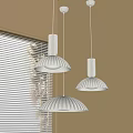 Three Beige Pendant Lights With Wooden Texture Lampshades And Natural Light