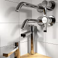Modern Chrome Faucets With Sleek Handles On White Tile Bathroom Wall