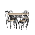 Classic Round Wooden Table And Black Metal Chairs Set With Curved Design And Wooden Seats