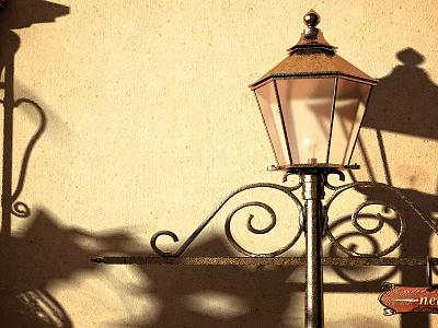 Vintage Outdoor Lamp With Ornate Metal Scroll Design And Glass Shade Casting Shadow On Wall 3d model