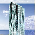 Modern High Rise Residential Building With Glass Facade Windows And Blue Sky Background