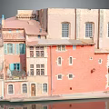 Pastel Colored Multi Story Traditional Residential Building With Multiple Windows And Balconies