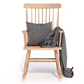 Cozy Wooden Rocking Chair with Gray Cushion and Soft Comfortable Blanket