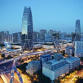 Modern Urban Skyline Featuring Skyscrapers Overpasses And Evening Traffic Lights