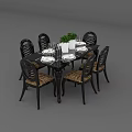 Elegant Black Wood Dining Table Set With 6 Rattan Seats And Green Plant Decor